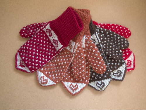 Die Fäustlinge "Herzband".